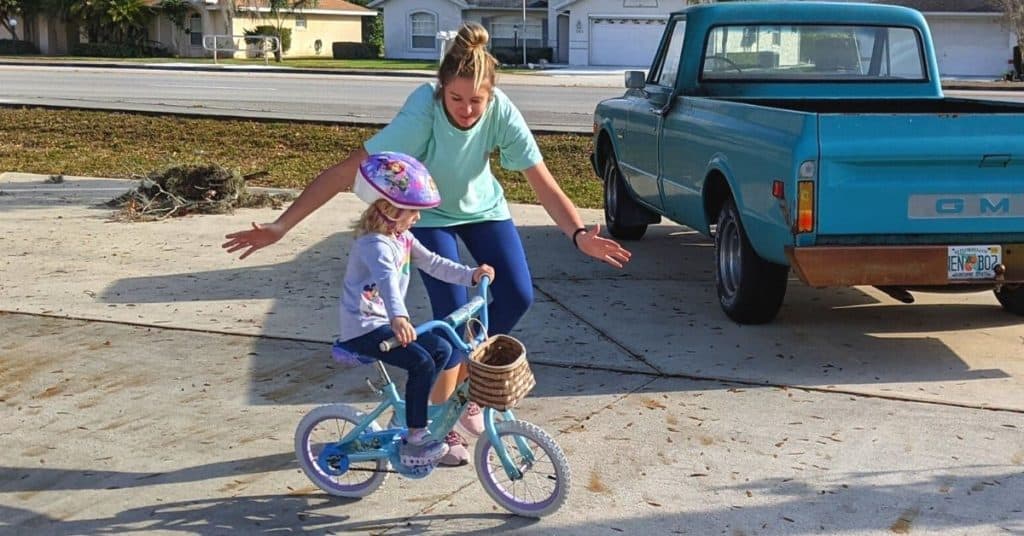 Mom Teaching Daughter to ride a bike